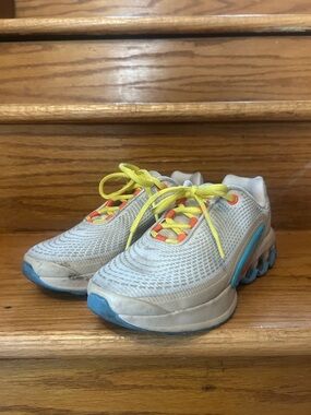 Nike Kids White Sneakers with Yellow Laces and Blue Accents